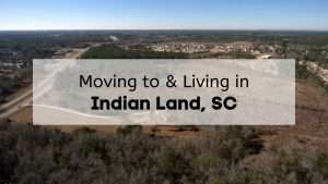 An aerial view of a row of homes and roads in South Carolina with the text, "Moving to & Living in Indian Land, SC," overlaid